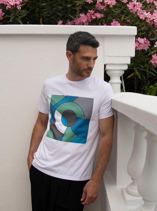 white cotton t-shirt with square print in geometric shapes of green, blue and grey